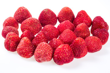 luscious frozen strawberries isolated on white background, delicious first class organic fruit as a concept of summer vitamins