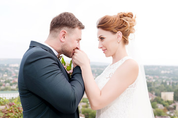 Newlyweds on the background of the cityscape of the resort city in the North Caucasus
