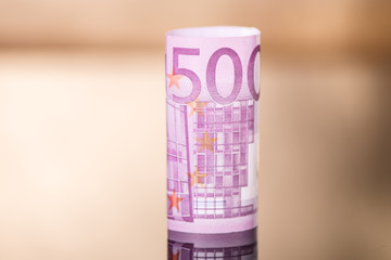 five hundred euro note bill rolled up