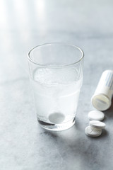 Effervescent tablet in a glass o water