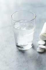 Effervescent tablet in a glass o water