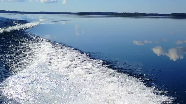 Slow motion shot of splashing water of a boat's wake