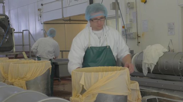 Food factory employees checking equipment