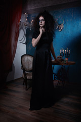 Obraz na płótnie Canvas Evil witch in a dark room
