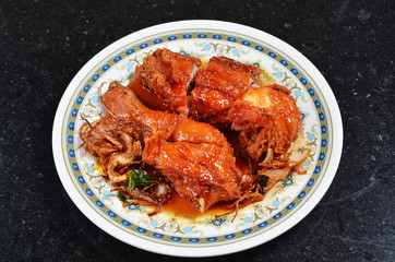 Spicy fried chicken on the plate   