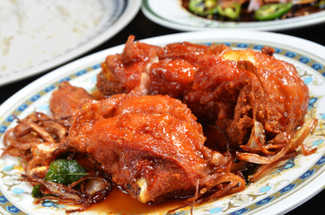 Spicy fried chicken on the plate   