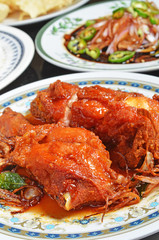 Spicy fried chicken on the plate   