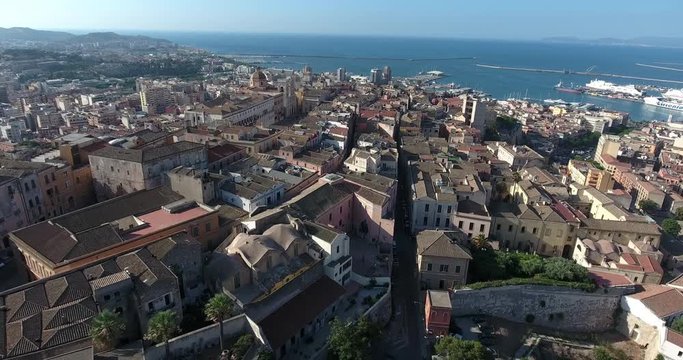 CAGLIARI, SARDINIA, ITALY  – JULY 2016 : Aerial shot over Cagliari cityscape on a beautiful day with view of harbour and city centre