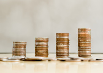 step of coins stacks with nature background, money, saving and investment or family planning concept.