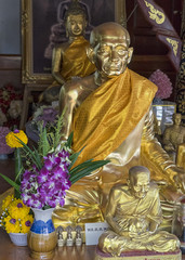 Statue of a buddhist monk in a temple in Bangkok Thailand
