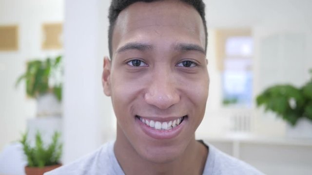 Portrait Of Smiling African Young Man, Ofice