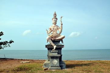 Embankment in Kep, Cambodia. Beautiful buddhist statue on the bank of the sea