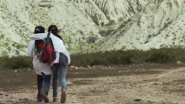 Argentine Primary School Girls walking in the Mountains. Back to School Concept.