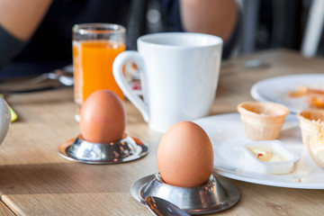 Bright and healthy breakfast, raw vegetables salad, fresh lettuce, cheese shakes, Western fried egg with the original bread,