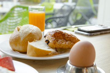 Bright and healthy breakfast, raw vegetables salad, fresh lettuce, cheese shakes, Western fried egg with the original bread,