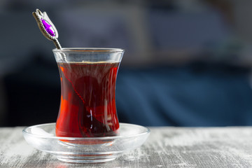 Red tea in turkish glasses on a wooden table