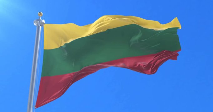 Flag of Lithuania waving at wind with blue sky in slow, loop