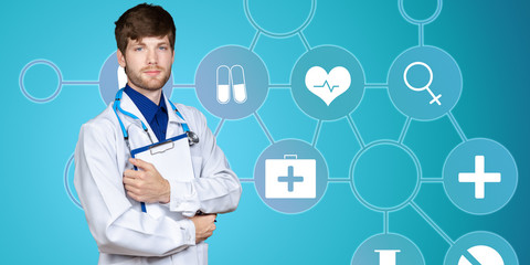 Young confident doctor man in medical gown