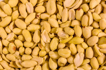Texture of peeled roasted peanuts for the background