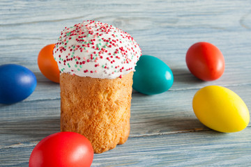 Homemade Easter Bread and eggs on the wooden background. Easter Cake - Russian and Ukrainian Traditional Kulich. Selective focus.
