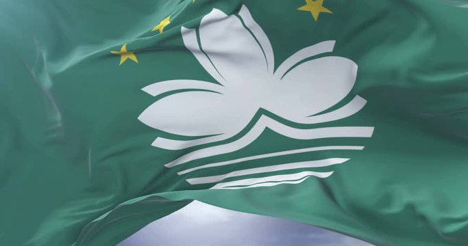Flag of Macau waving at wind with blue sky in slow, loop