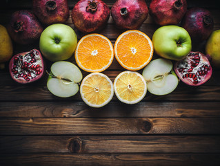 Collection of autumn vitamins. Frame of fresh fruit on wooden background. Multivitamin concept. Copy space.