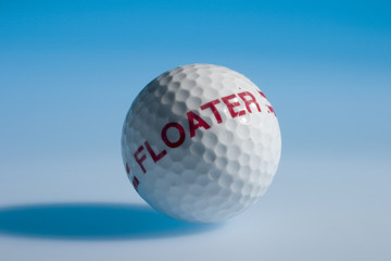 Golfball on blue background