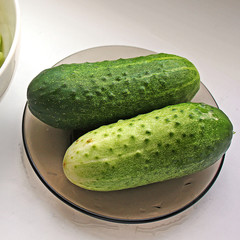 Cucumbers on a plate. Sliced cucumbers. Food.