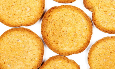 Integral rusks with wholewheat flour, bread slices isolated on white background, top view