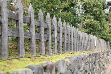 Wood fence on the stone wall in japan