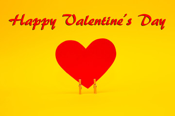 Happy Valentines Day card with red paper heart on yellow background