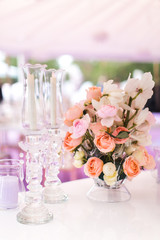 Candles and beautiful bouquet flower in vase