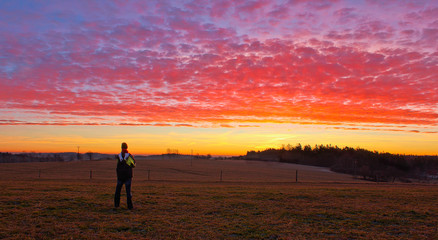 Obraz na płótnie Canvas Young man stand and looking to famous witer sunrise on Czech countryside