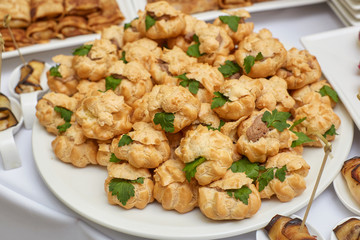 Catering food table of appetizers, snacks and canapes