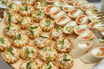 Catering food table of appetizers, snacks and canapes
