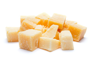 Small pieces of parmesan cheese on white background