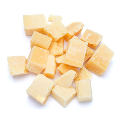 Small pieces of parmesan cheese on white background