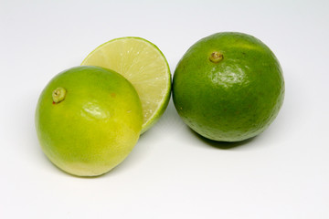 Half of lime citrus fruit isolated on white background. Sliced lemon half 