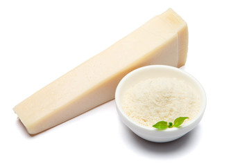 a piece of Parmesan cheese on white background with grated