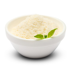 grated Parmesan cheese in ceramic bowl on white background