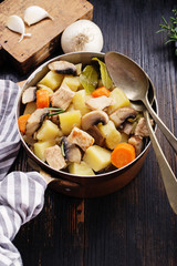 Mushroom stew on black rustic board