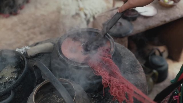 Woman make wool textile.Handmade traditional colorful wool. Peru woman make alpaca textile .