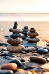 Pile of Balanced Rocks at the Beach at Sunset time