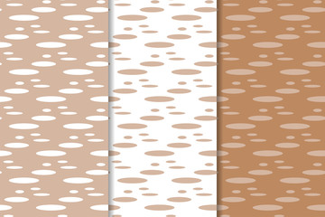 Brown and white geometric ornaments. Set of seamless patterns