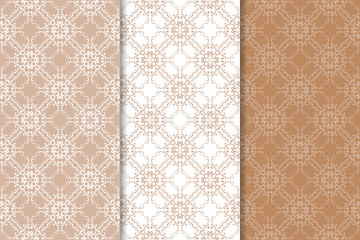 Set of floral ornaments. Brown, beige and white seamless patterns