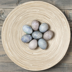 Fototapeta na wymiar Natural dyed grey Easter eggs