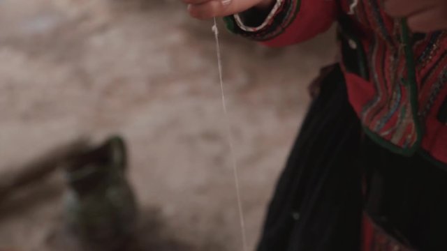 Woman make wool textile.Handmade traditional colorful wool. Peru woman make alpaca textile .