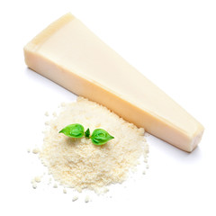 a piece of Parmesan and grated cheese on white background