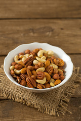 mixed nuts on wooden surface