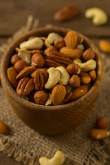 mixed nuts on wooden surface